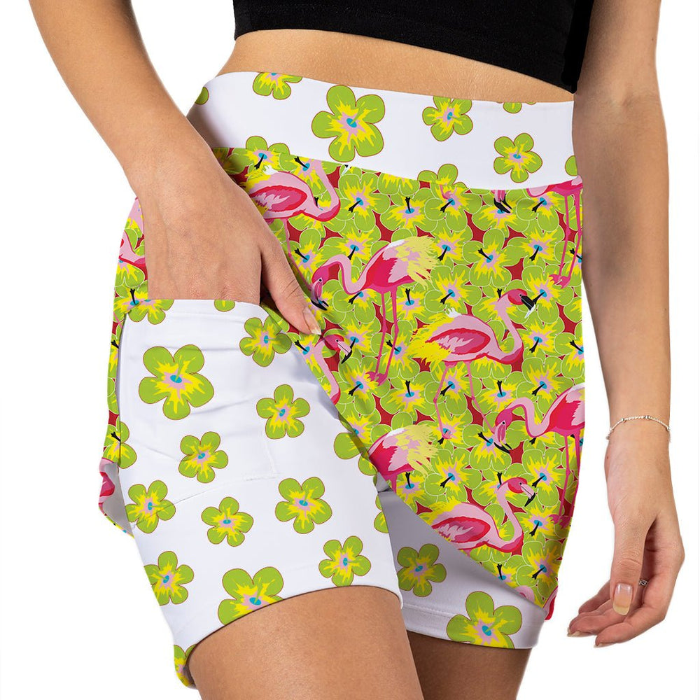 Colorful shorts with flamingo and floral pattern on a white background