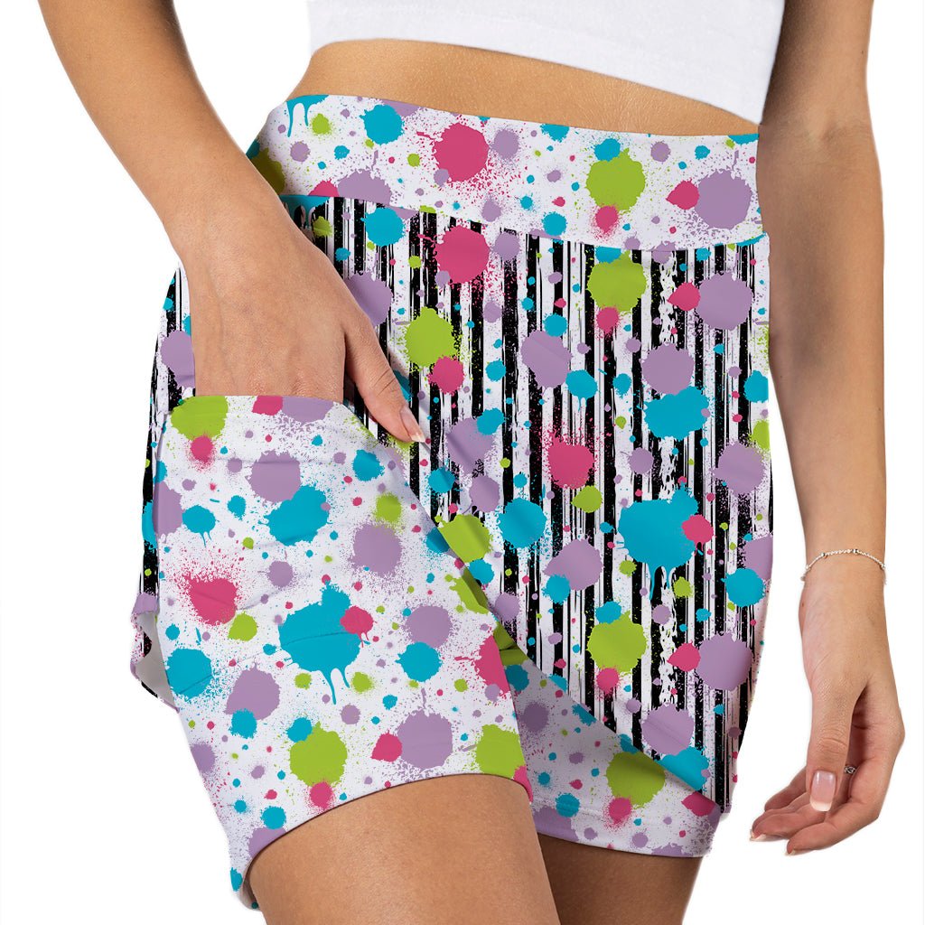 Colorful polka dot and stripe patterned shorts on a white background