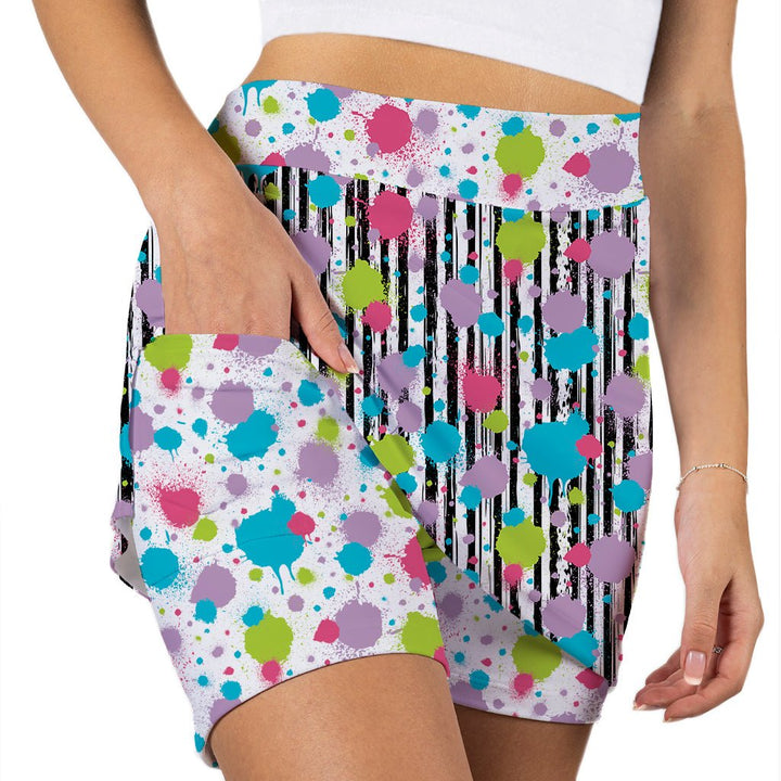 Colorful polka dot and stripe patterned shorts on a white background