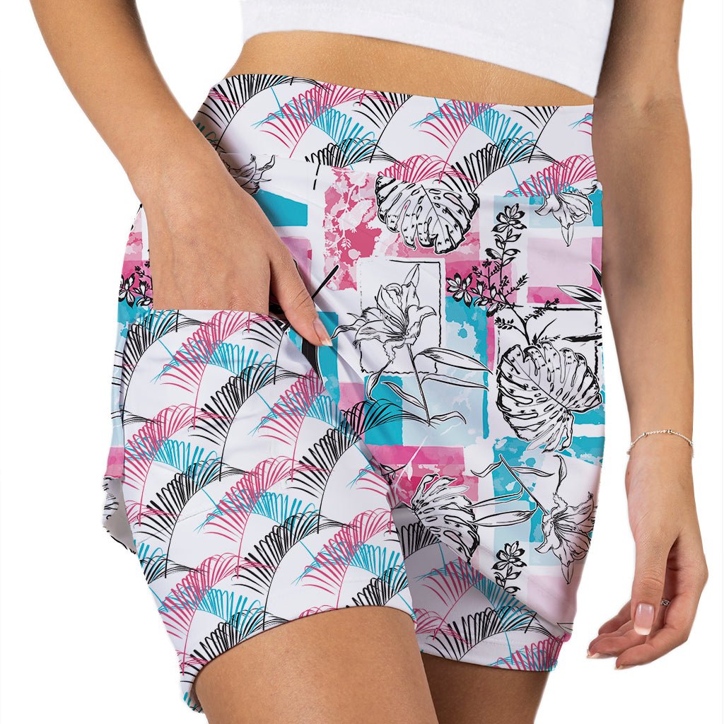 Person wearing colorful patterned shorts on a white background