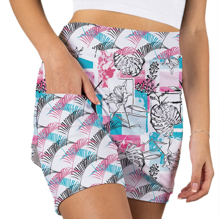 Person wearing colorful patterned shorts on a white background