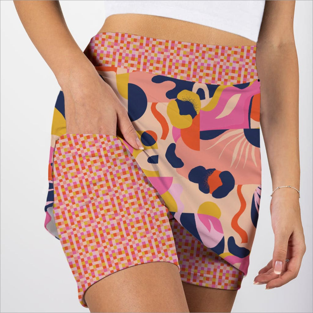 Colorful patterned skorts with a geometric design on a plain background