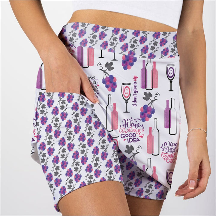 Shorts with wine-themed pattern on a white background
