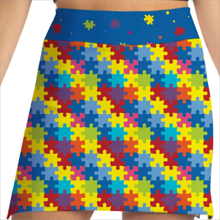 Colorful puzzle pattern skirt on a plain background